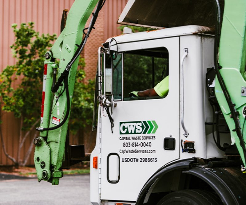 Collection truck in a business parking lot