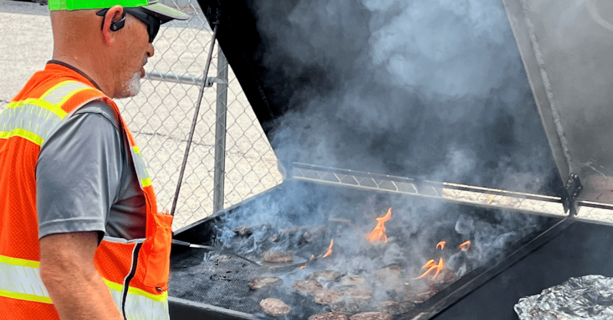 CWS_Chattanooga_employee_cooking_on_the_custom-made_dumpster_grill.png
